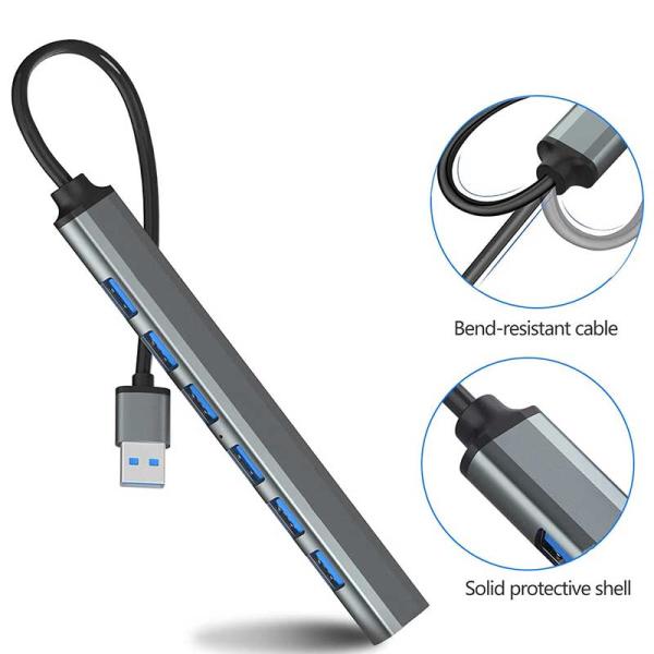 7-Port USB 3.0 Ultra Slim Portable Hub in grey aluminum alloy, featuring independent switches and 5Gbps data transfer for desktop and laptop setups