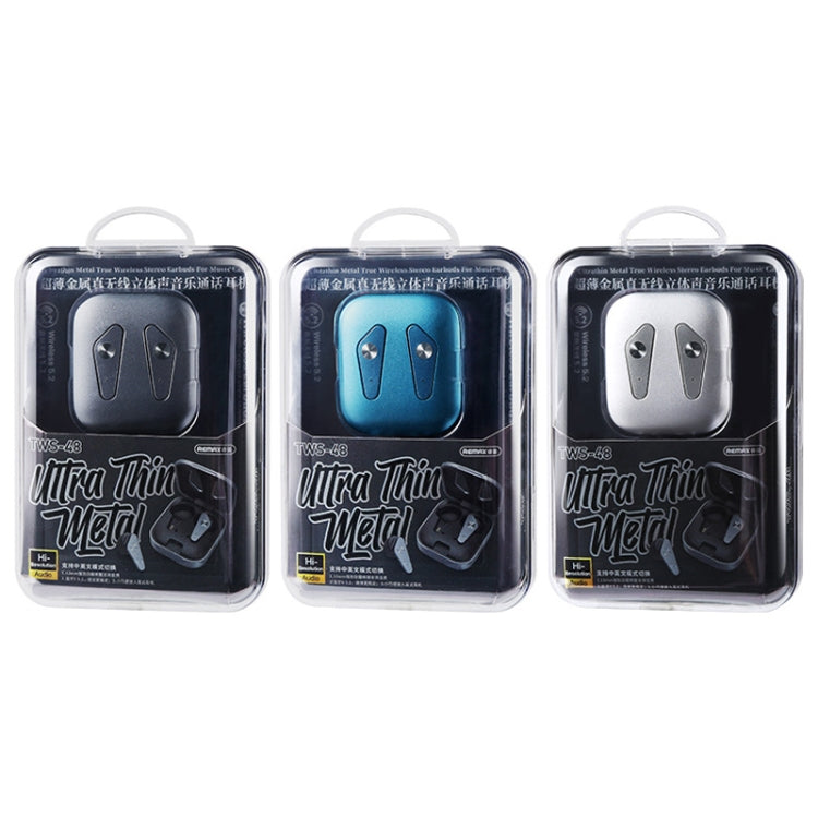 Close-up of the REMAX TWS-48 slim metal charging case and earbud drivers