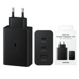 Samsung 65W Trio PD power adapter featuring its standard EU two-pin plug configuration, triple out port matrix with dual Type-C slots and a single USB-A channel, and compact portable casing
