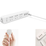 Mi Power Strip featuring 3 international sockets, 3 USB ports, and fast charging capability in a compact, minimalist design