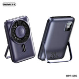 Remax RPP-695 3-in-1 wireless power bank featuring 10000mAh capacity, dedicated Apple Watch charger, 15W magnetic phone charging, and foldable kickstand