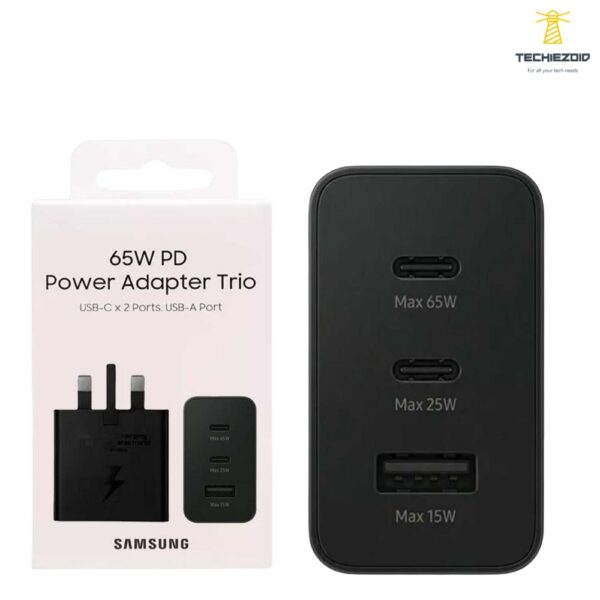 Samsung 65W Trio PD power adapter showing its rectangular UK three-pin wall connection geometry, triple output port configuration panel with dual Type-C slots and single USB-A bay, and robust compact housing