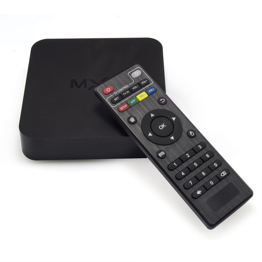 Smart Box MXQ 4K smart TV box highlighting its compact square design, outer interface port panel featuring four USB host bays, an SD card slot, an HDMI out port, and its bundled remote controller