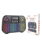 SpeedX i10 mini dual-mode wireless and Bluetooth handheld keyboard highlighting its 92-key silicon layout, integrated multi-gesture touchpad, 7-color glowing backlighting grid, and compact plastic shell housing