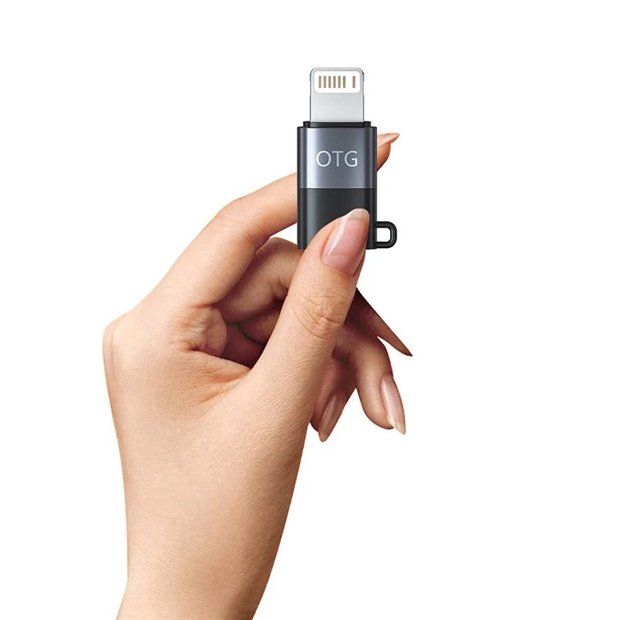 Type-C to Lightning OTG audio adapter dongle highlighting its high-conductivity male Lightning interface terminal, precision female Type-C connector port, and compact solid-state chassis