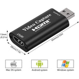 Black video capture device with dimensions and system compatibility icons on a white background