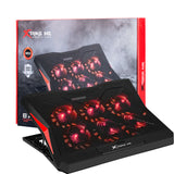 Xtrike Me FN811 gaming laptop cooling pad with 6 fans, manual speed control knob, and red LED illumination